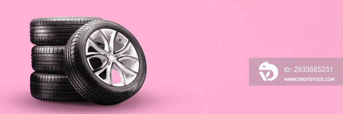 summer tires and wheels-stack on pink background, new wheels long blank layout copyspace