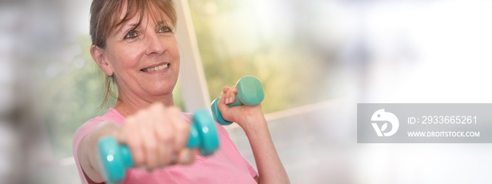 Woman exercising with dumbbells