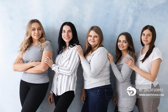 Beautiful young women on color background. Concept of body positivity