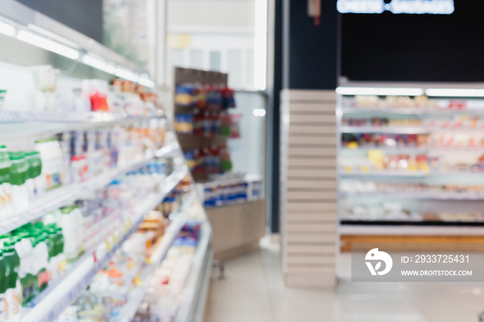 Blurred background of counters with food in supermarket