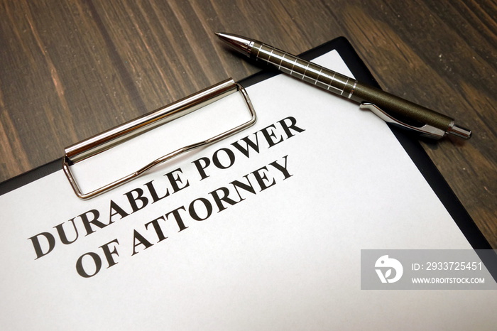 Clipboard with durable power of attorney and pen on desk