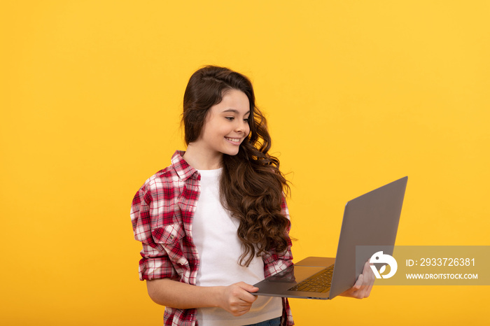 happy smart child hold laptop during school online lesson, school