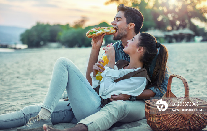 Beautiful young couple having fun on the beach. Lifestyle, love, dating, vacation concept