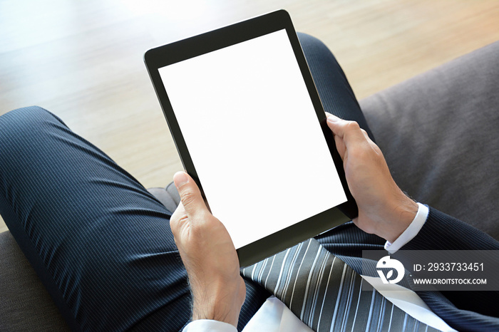 Businessman hands holding tablet pc with empty screen