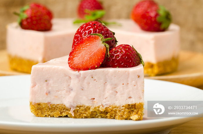 Homemade strawberry cheesecake  on white plate