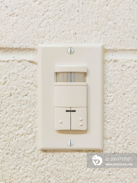 Close up shot of a light switch with sensor