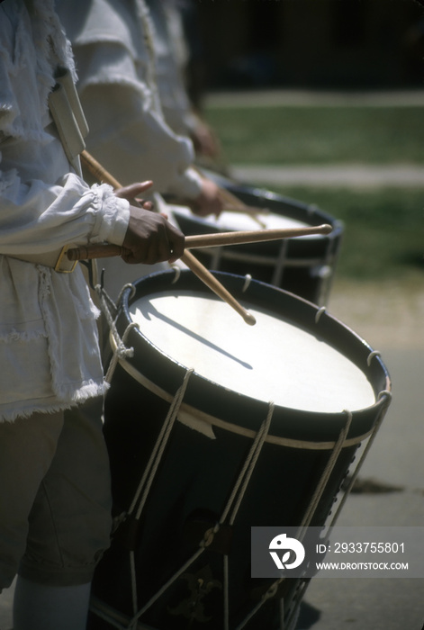 Drummers in white colonial uniforms