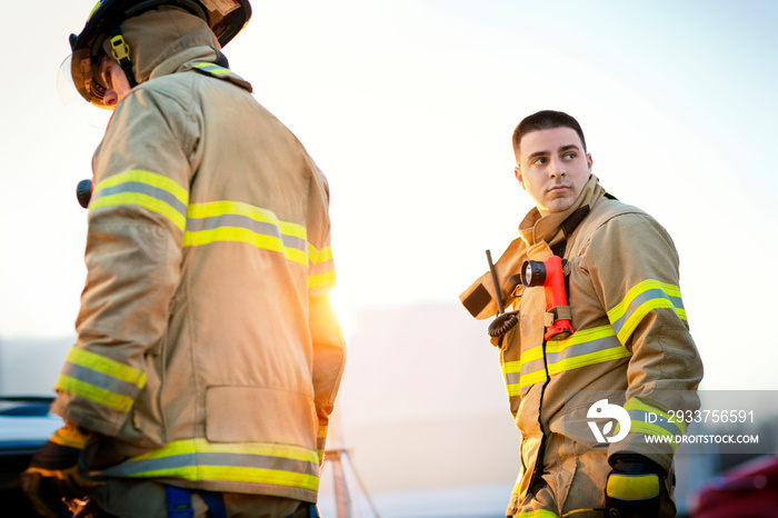 Firefighters walking outdoors