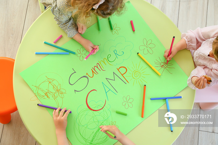 Little children during art lesson in summer camp