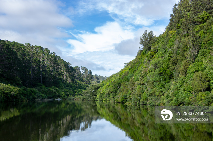 Karori reservoir mirror like reflection of New Zealand mountains