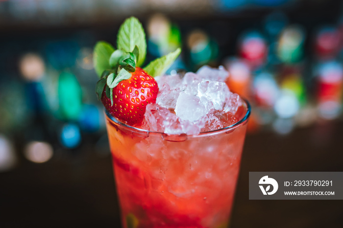 Red or pink alcoholic strawberry cocktail drink in restaurant or bar