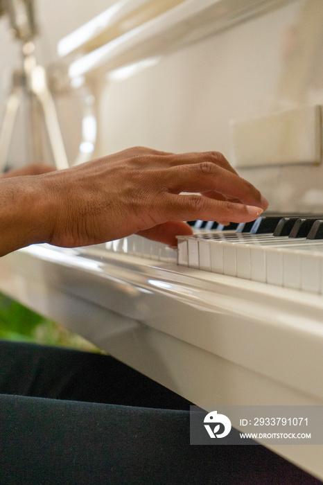 UK, London,�Close-up�of hands of man playing piano