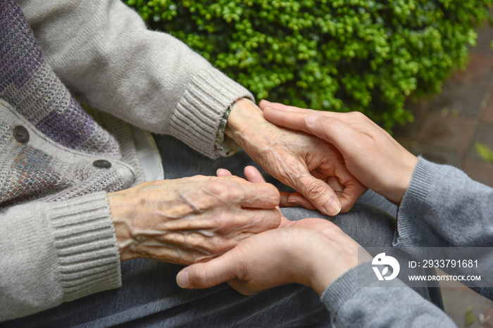 Touches the hands of an old woman - Concept of Elderly care