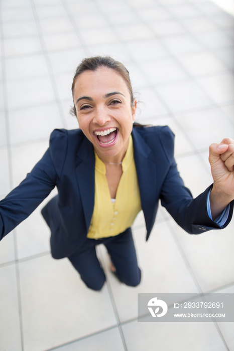 Portrait happy businesswoman celebrating