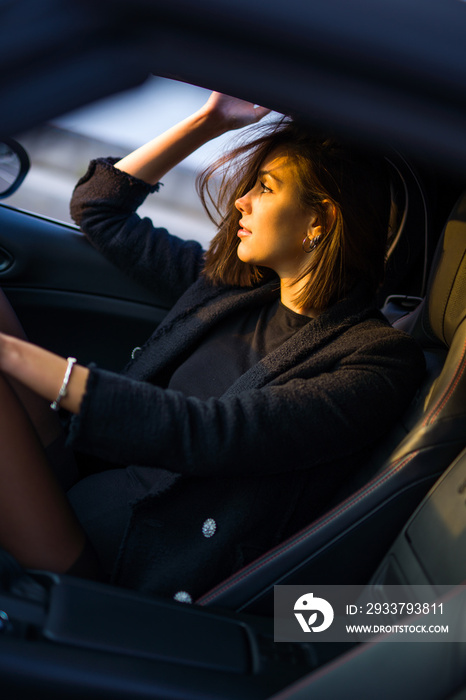 beautiful girl smiling while driving spyder car