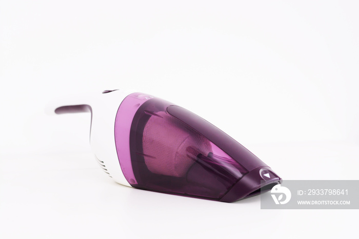 Isolated purple hand held vacuum cleaner