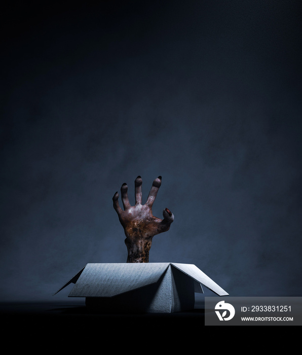 Monster hand in a open cardboard box,3d rendering