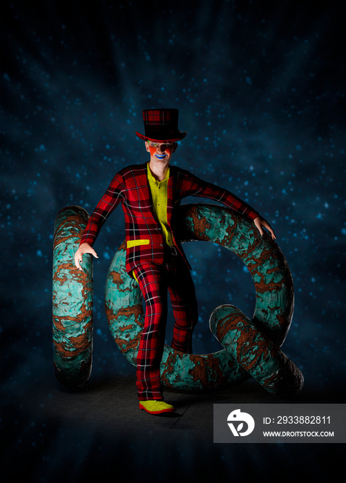 Poster of a colorful joker crawling through rusty iron rings forming the letters IQ. 3D rendering