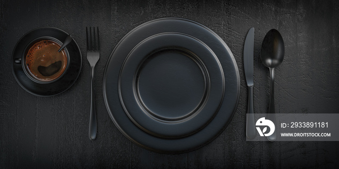 Top view of black plate, fork, knife, spoon and cup of coffee on black grunge table.