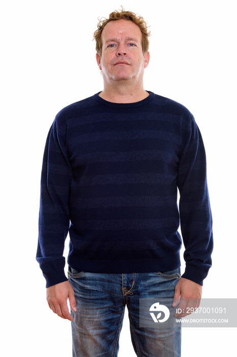 Studio shot of mature man with curly blond hair isolated against white background