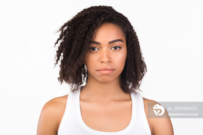 Headshot of serious black girl at studio