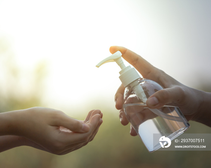 Washing hands by alcohol sanitizers.