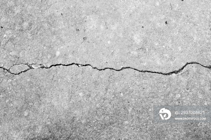 Crack white concrete texture close up background.