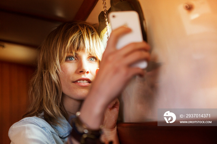 Young woman taking selfie