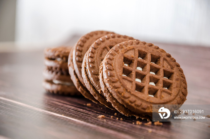 sandwich cookies on a wooden table. Close-up.