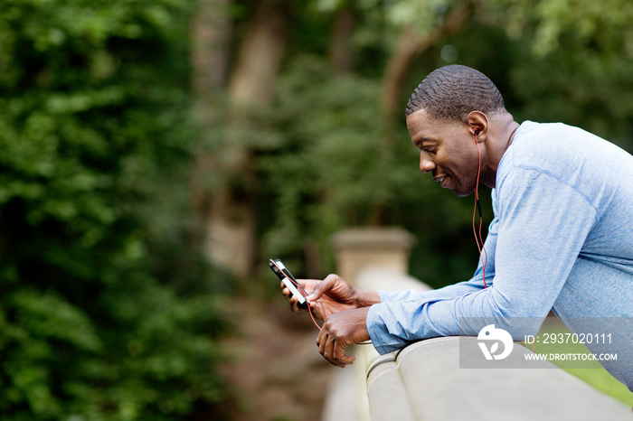 Man using snartphone in park