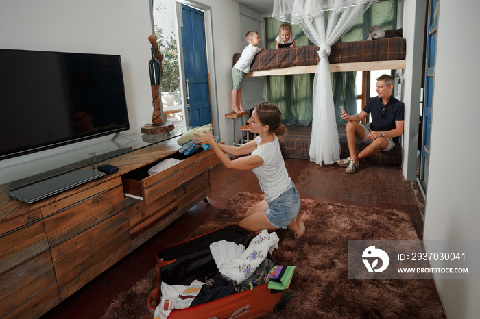 Family Arriving At Summer Vacation Rental hotel