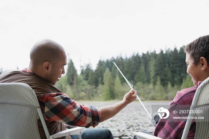 father and son enjoying fishing together