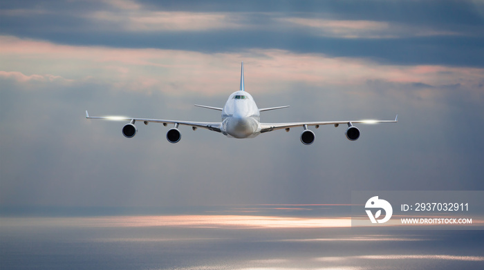 White passenger airplane in the clouds - Travel by air transport