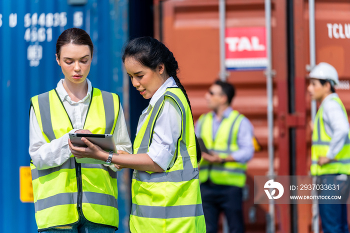 Group of Diversity factory worker women meeting to inspect containers logistic in local warehouse. a