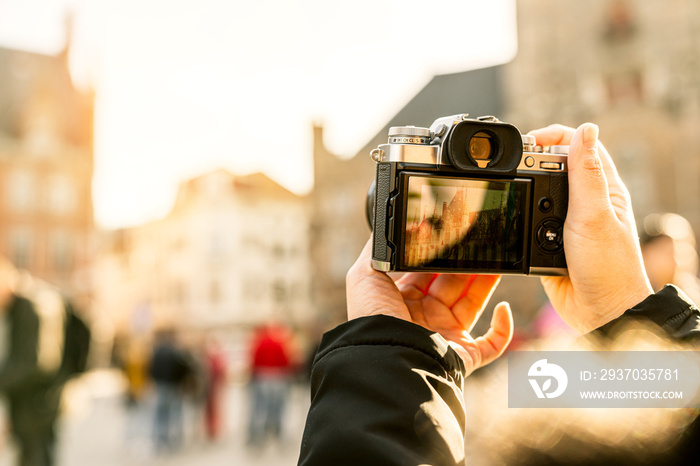 closeup asian woman hand hold retro camera traveller with background of old tradition architecture,a
