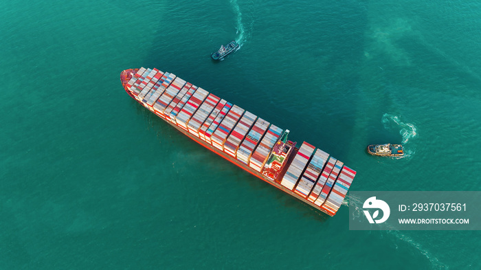 Aerial top view Tug boats drag container ship to sea port for unload container to container warehous