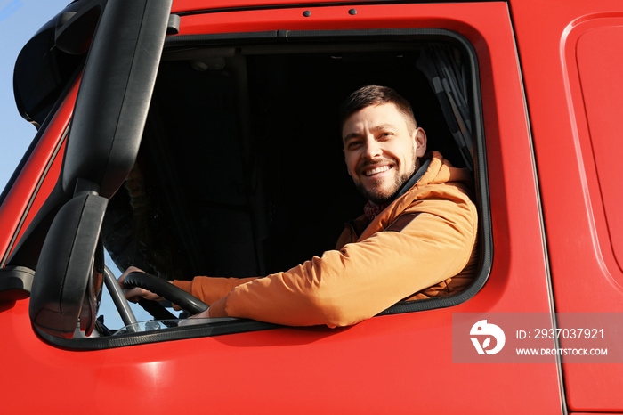 Male driver looking out of truck window