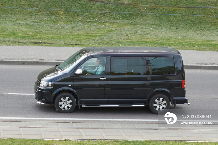 Black minibus in the city