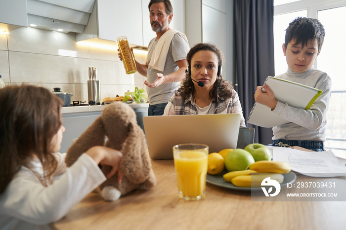 Working woman looking at camera with desparation at home