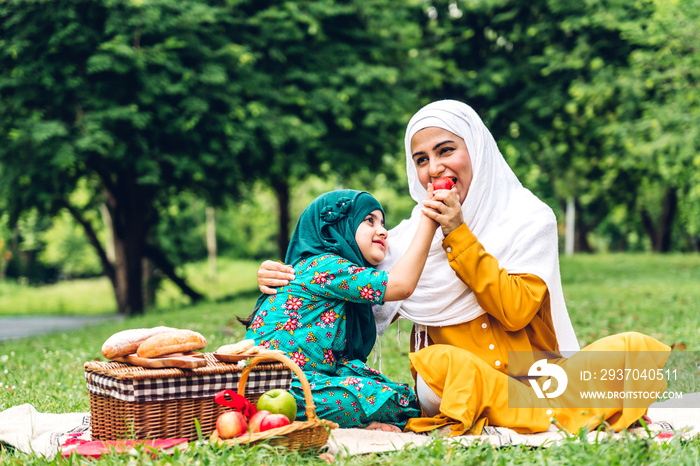 Portrait of happy religious enjoy happy love asian family arabic muslim mother and little muslim gir