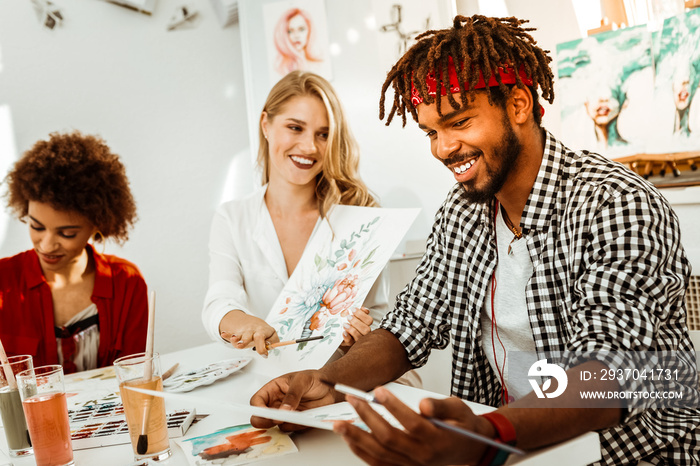 Handsome bearded man with dreadlock feeling joyful