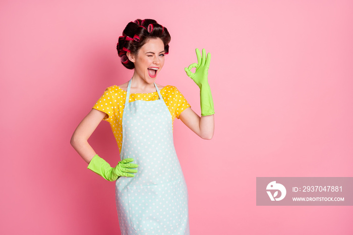 Ideal promo concept. Positive girl show okay sign blink wear yellow dotted skirt latex gloves isolat