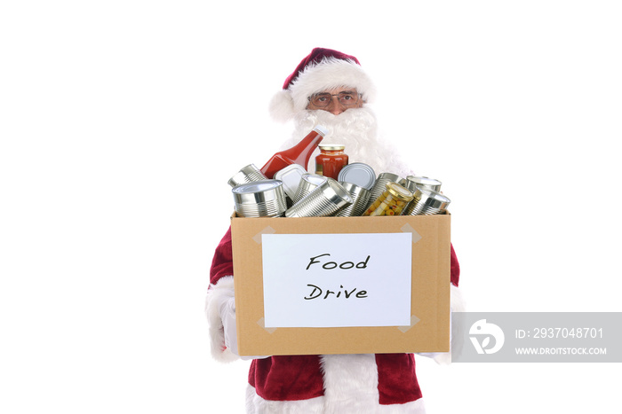 Senior man wearing a traditional Santa Claus costume holding a cardboard box full of food for a char