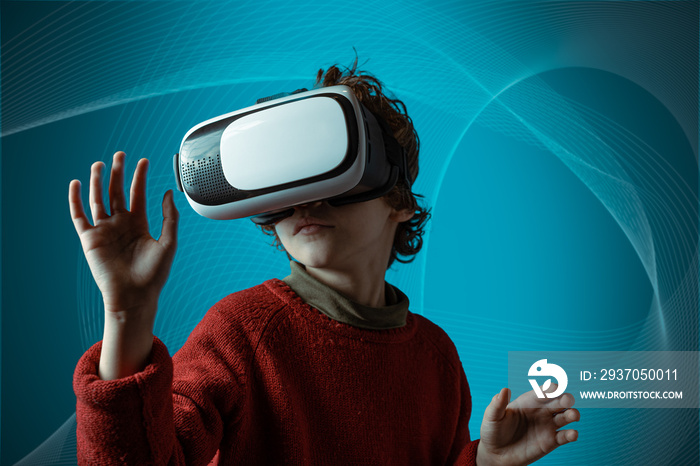 Digital native 7 years old boy wearing vr glasses putting hands out in excitement isolated on a comp