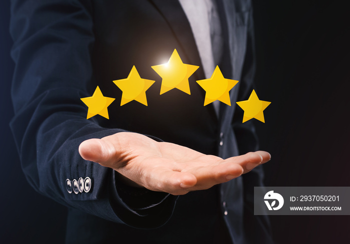 Unrecognizable Businessman Holding Five Stars Icons On Open Hand