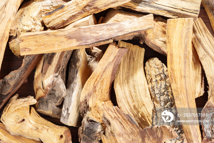 Sacred wood  palo santo  - Bursera graveolens,on rustic wood background