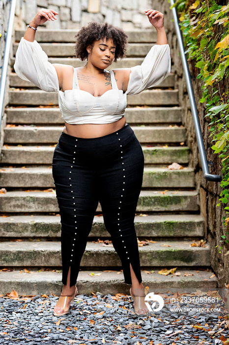 Plus size Black woman showing off fashion outside