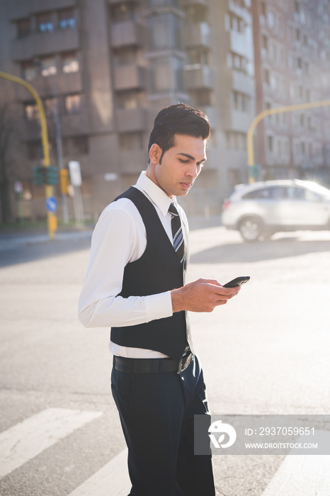 Young businessman using smartphone