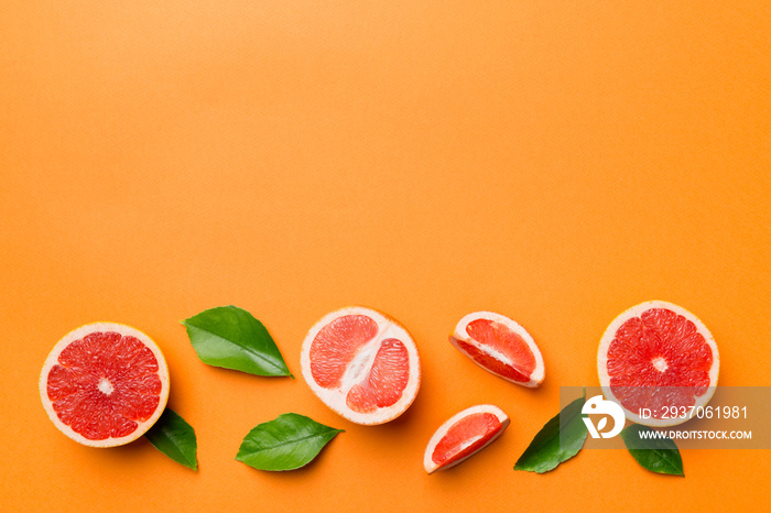 fresh Fruit grapefruit with Juicy grapefruit slices on colored background. Top view. Copy Space. cre