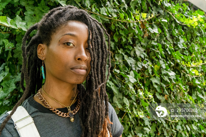 Portrait of stylish young woman outdoors